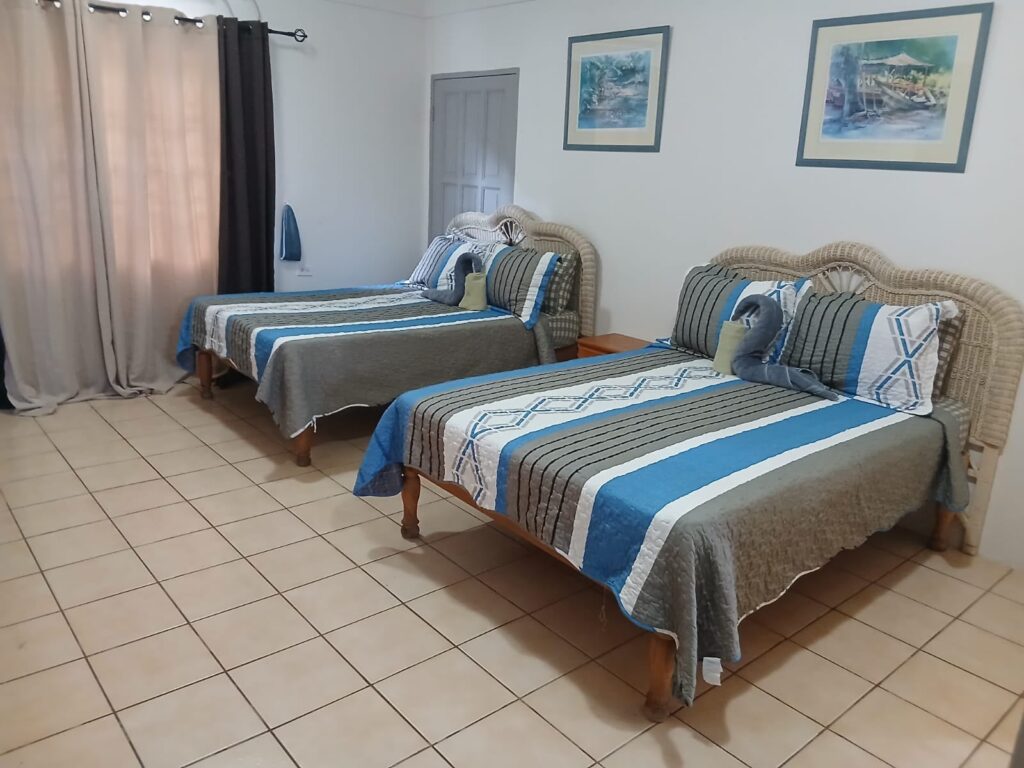 Bona Villa, Bon Accord, Tobago: a second bedroom with two double beds.