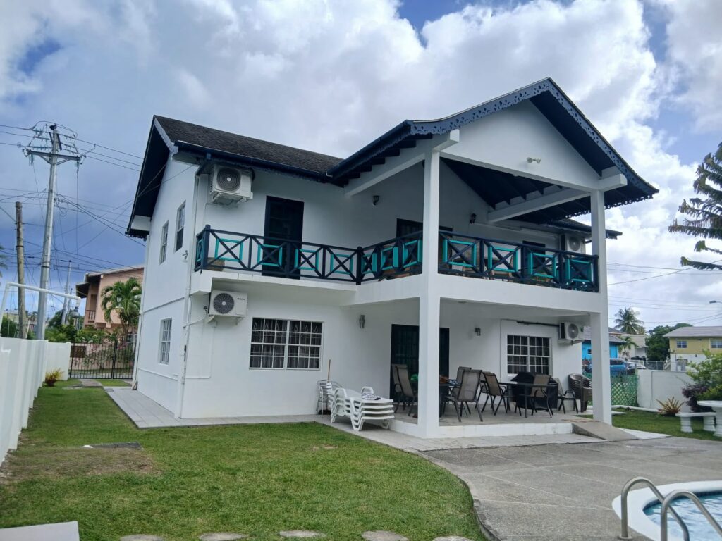 Bona Villa, Bon Accord, Tobago: the villa seen from the garden, with the pool to one side.