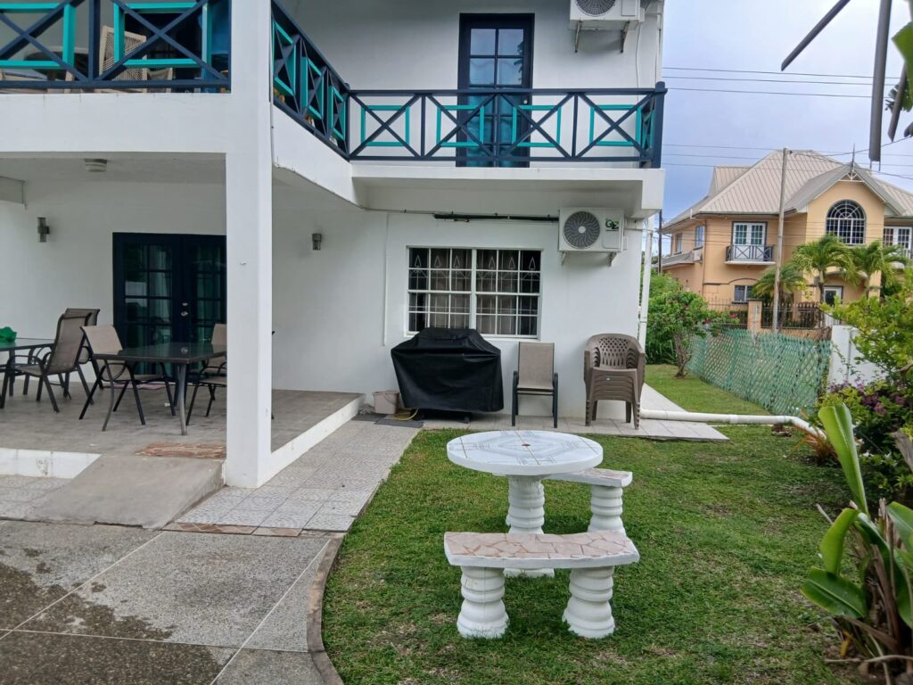 Bona Villa, Bon Accord, Tobago: the rear elevation, with the patio and lawn.
