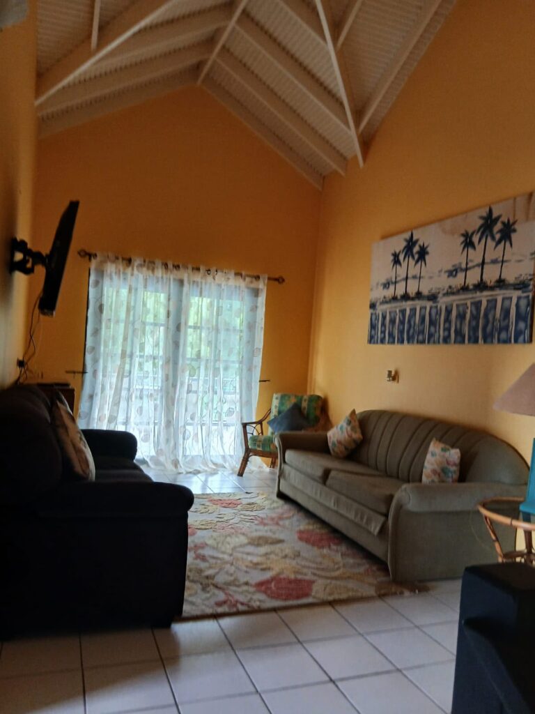 Bona Villa, Bon Accord, Tobago: the upstairs sitting room, under a vaulted timber ceiling.