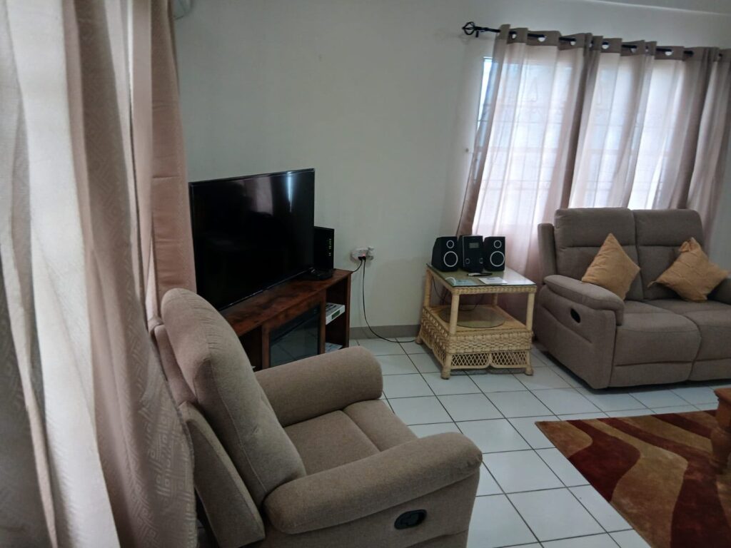Bona Villa, Bon Accord, Tobago: the television room, with recliner seating.